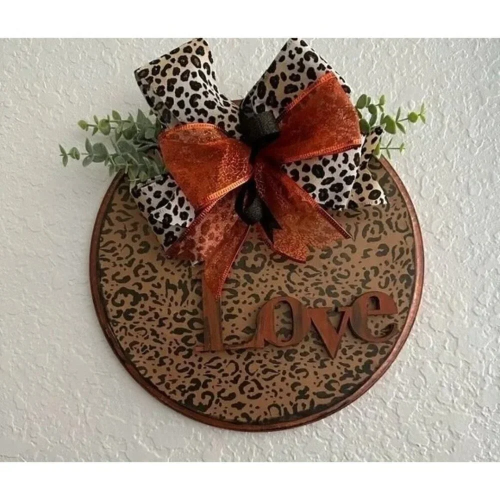 Love animal print wall hanging with‎ orange accents